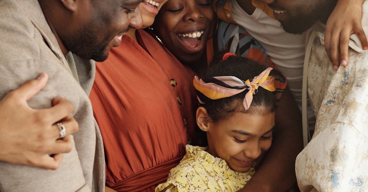 Heartwarming family group hug showcasing affection and togetherness indoors.